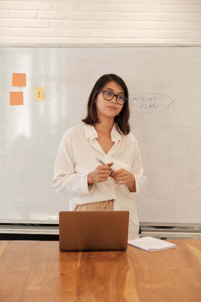 Woman with Laptop Doing Presentation in the Office